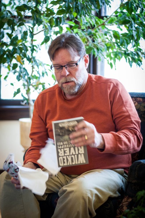 John Miller receiving a book